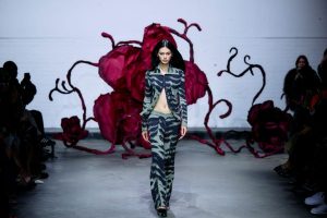 A model presents a creation during a catwalk presentation of the Autumn-Winter 2025-2026 collection from Asian-US designer Chet Lo.