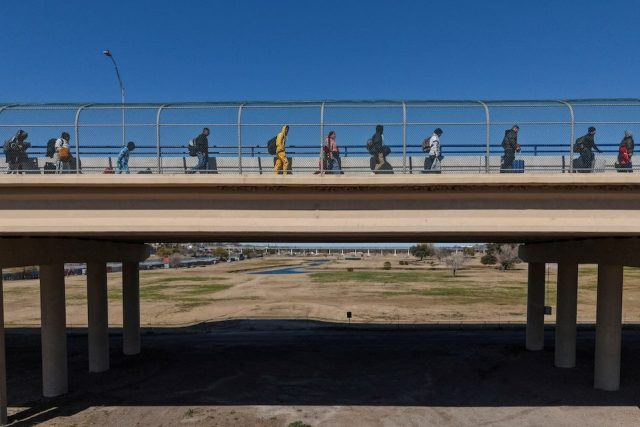 A drone view of migrants seeking asylum in the United States who previously requested an appointment on the U.S. Customs and Border Protection CBP One application, as they cross the Camino Real International Bridge to attend their appointment in Eagle Pass, Texas, U.S., January 19, 2025. A drone view of migrants seeking asylum in the United States who previously requested an appointment on the U.S. Customs and Border Protection CBP One application, as they cross the Camino Real International Bridge to attend their appointment in Eagle Pass, Texas, U.S., January 19, 2025.
